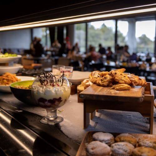 Enjoy a delicious hāngī buffet dinner overlooking Pohutu Geyser - Image 4