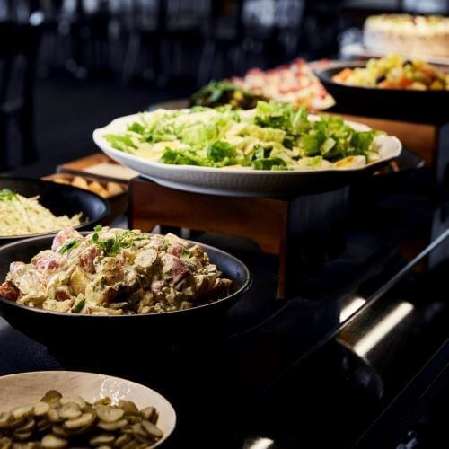 Enjoy a delicious hāngī buffet dinner overlooking Pohutu Geyser - Image 2